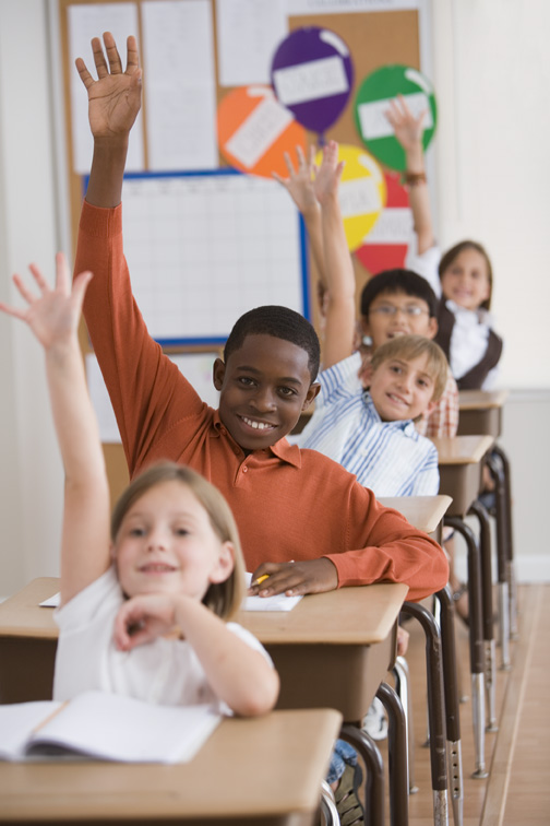 students raising hands